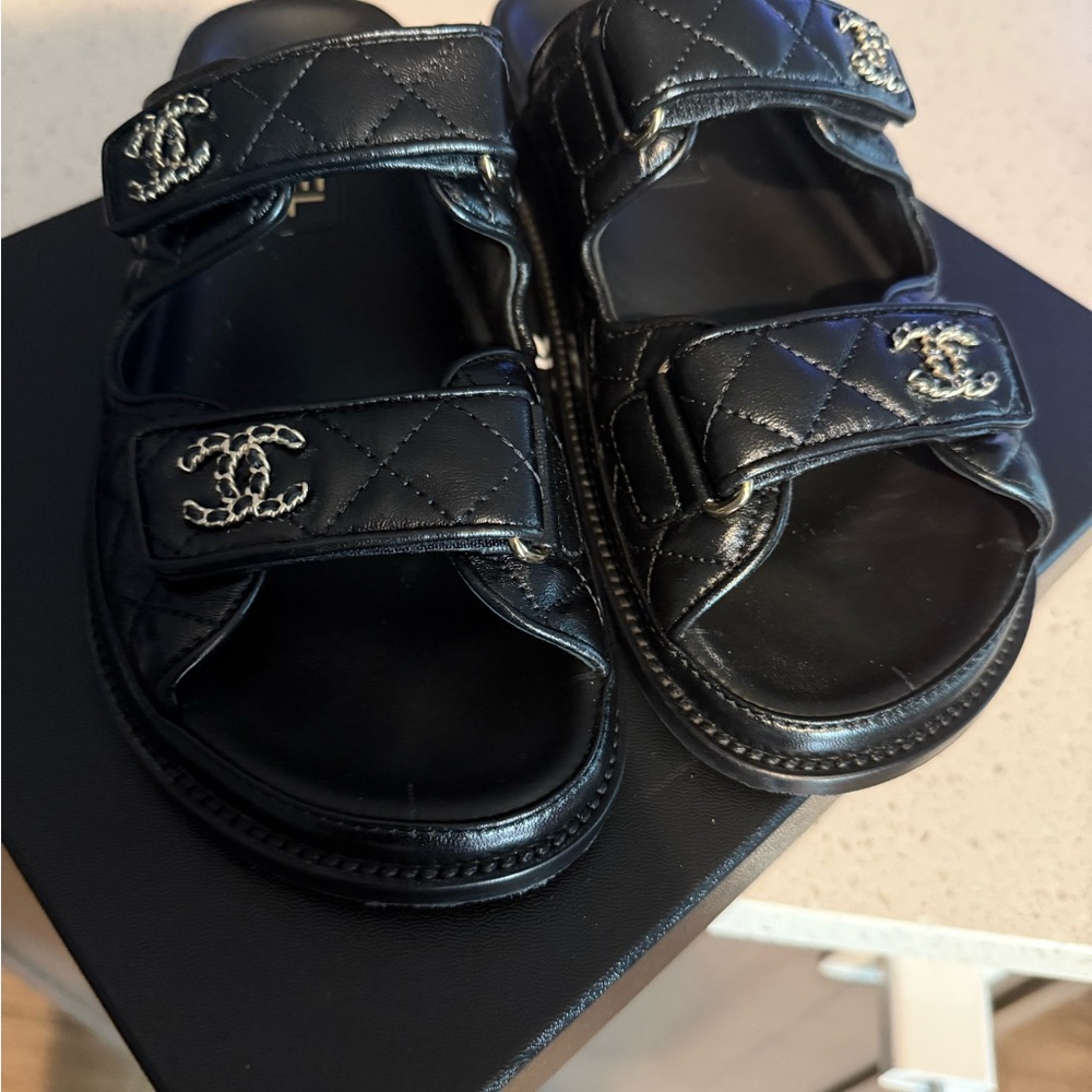 CHANEL Black Quilted Slides with Silver Logo